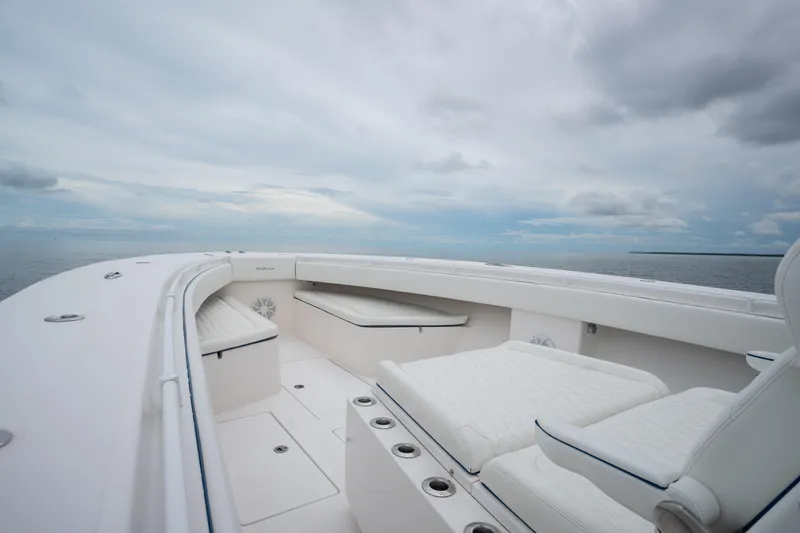  Yacht Photos Pics 2016 SeaHunter 45 boat interior with white seating, open sea view, and cloudy sky.