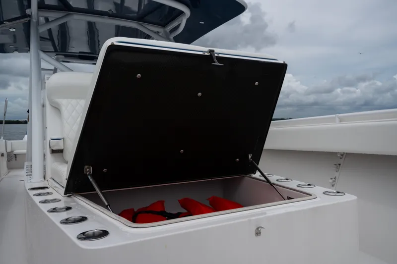  Yacht Photos Pics Open storage compartment on 2016 SeaHunter 45 boat, containing red life jackets.
