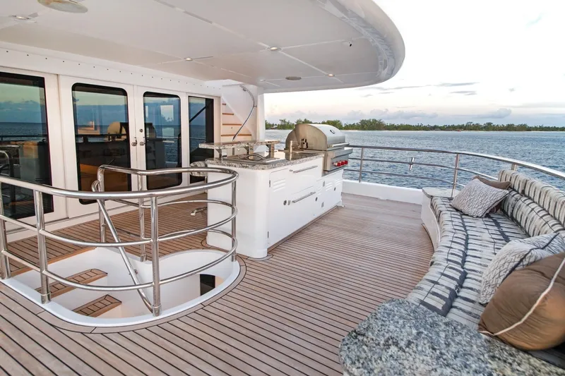  Yacht Photos Pics Luxurious 2017 Nordhavn 96 yacht deck with seating, grill, and ocean view.