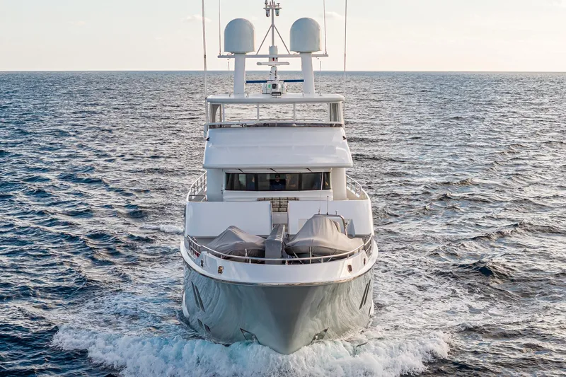  Yacht Photos Pics Front view of a 2017 Nordhavn 96 yacht cruising on the ocean.