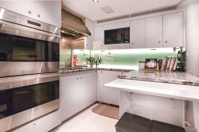  Yacht Photos Pics Luxurious 2017 Nordhavn 96 yacht kitchen with modern appliances and sleek design.