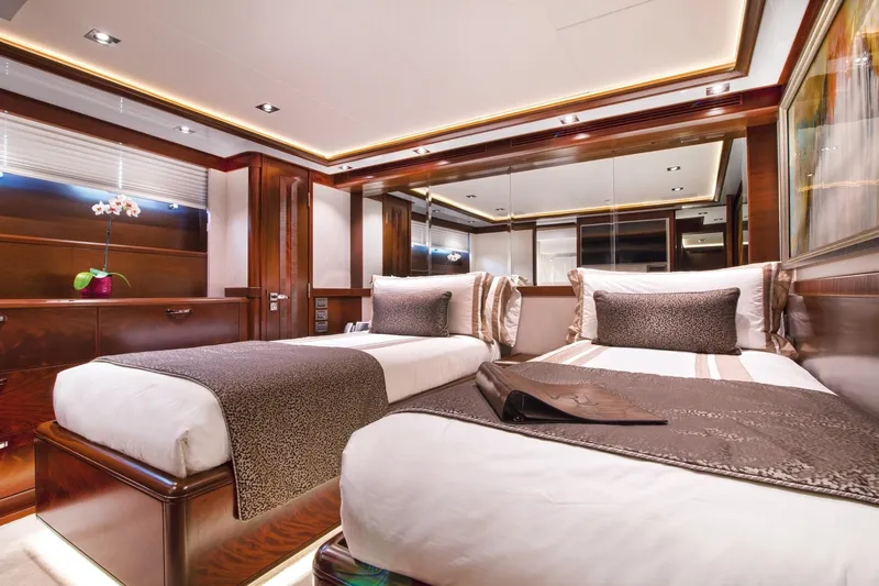  Yacht Photos Pics Luxurious cabin interior of 2017 Nordhavn 96 yacht with twin beds and elegant decor.