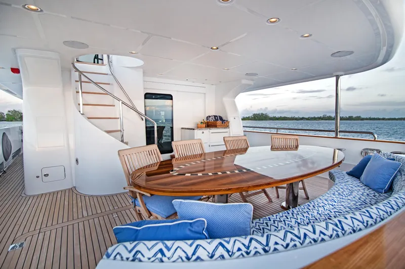  Yacht Photos Pics Luxurious 2017 Nordhavn 96 yacht deck with elegant dining area and ocean view.