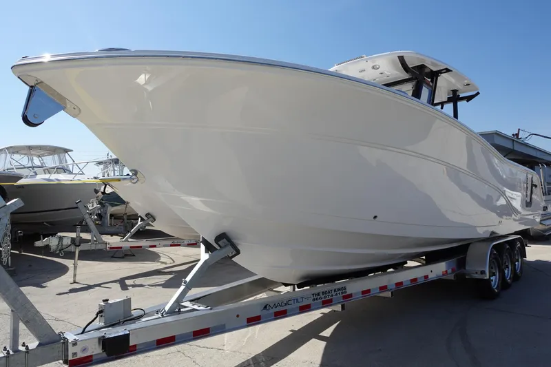  Yacht Photos Pics 2025 Sea Fox 328 Commander boat on a trailer under clear blue sky.