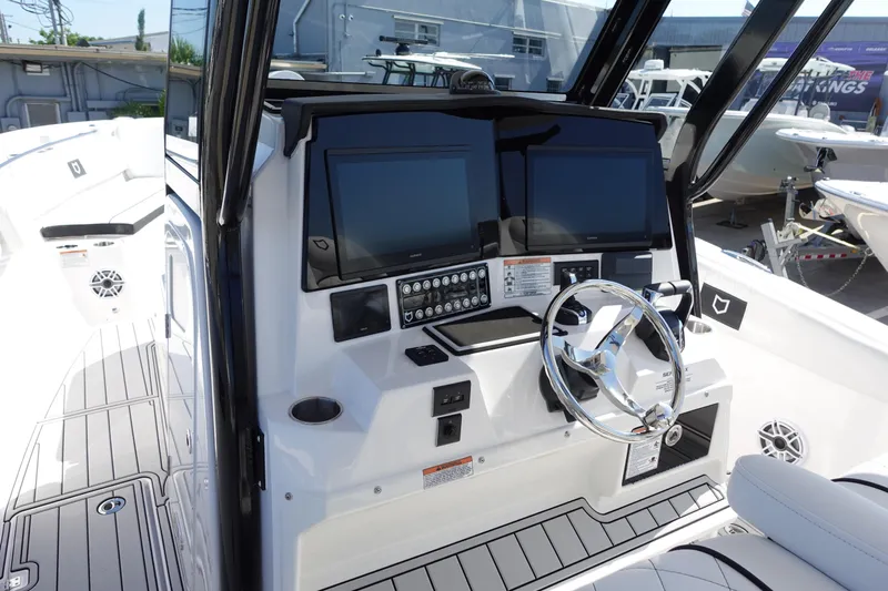  Yacht Photos Pics 2025 Sea Fox 328 Commander boat dashboard with dual screens and modern controls.
