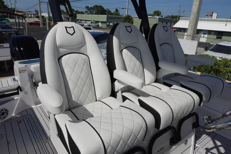  Yacht Photos Pics Luxurious seating on 2025 Sea Fox 328 Commander boat, featuring elegant white upholstery.