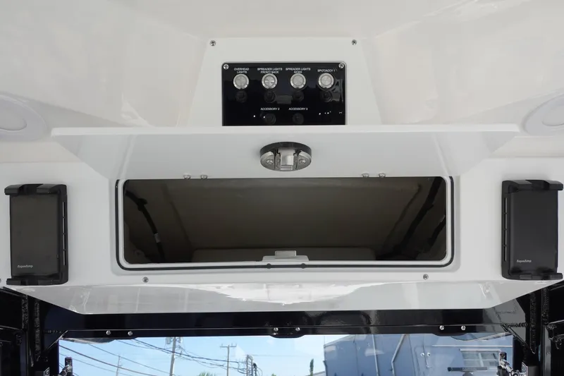  Yacht Photos Pics 2025 Sea Fox 328 Commander dashboard with control panel and storage compartment.