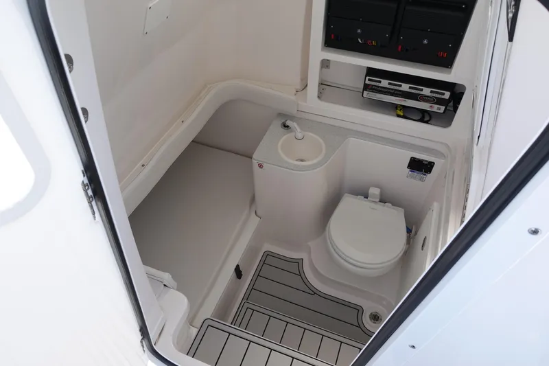  Yacht Photos Pics 2025 Sea Fox 328 Commander boat bathroom interior with toilet and sink.