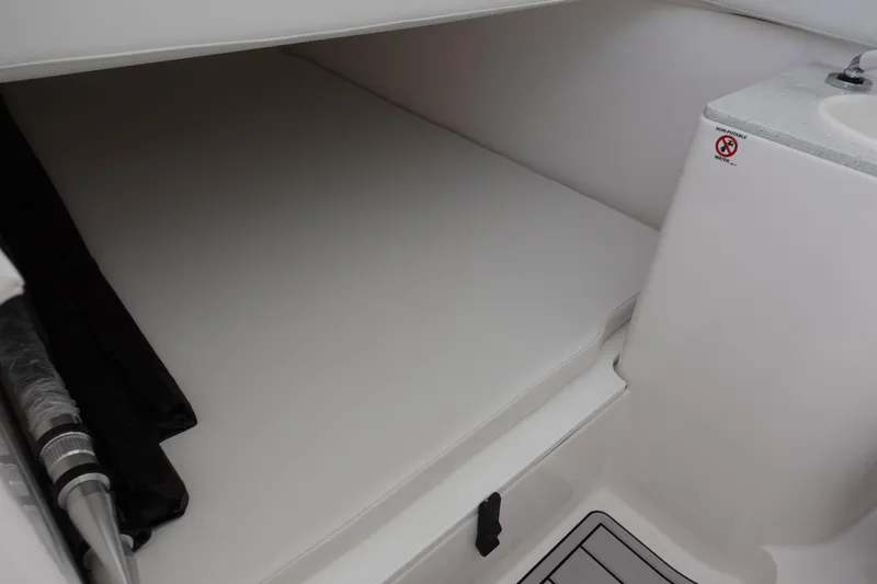 Yacht Photos Pics 2025 Sea Fox 328 Commander interior cabin with sleek white design and compact layout.