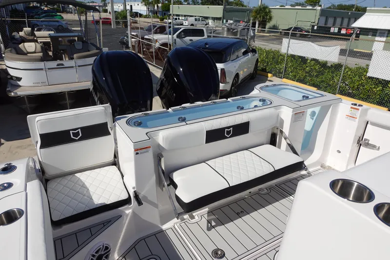  Yacht Photos Pics 2025 Sea Fox 328 Commander boat interior with seating and dual outboard motors.