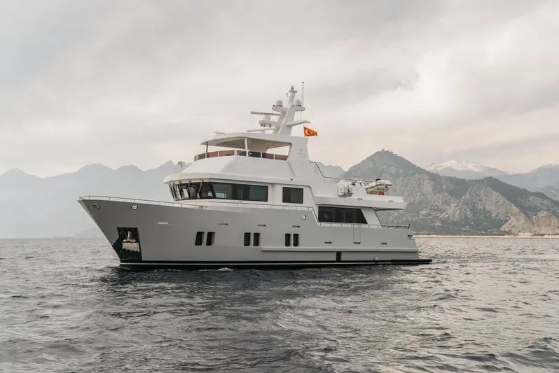Bering 65 Explorer Yacht Yacht Photos Pics Luxury Bering 65 yacht cruising on the sea with mountainous backdrop, 2026 model.