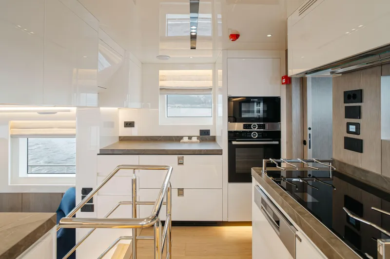 Bering 65 Explorer Yacht Yacht Photos Pics Modern kitchen interior of 2026 Bering 65 yacht with sleek appliances and stylish design.