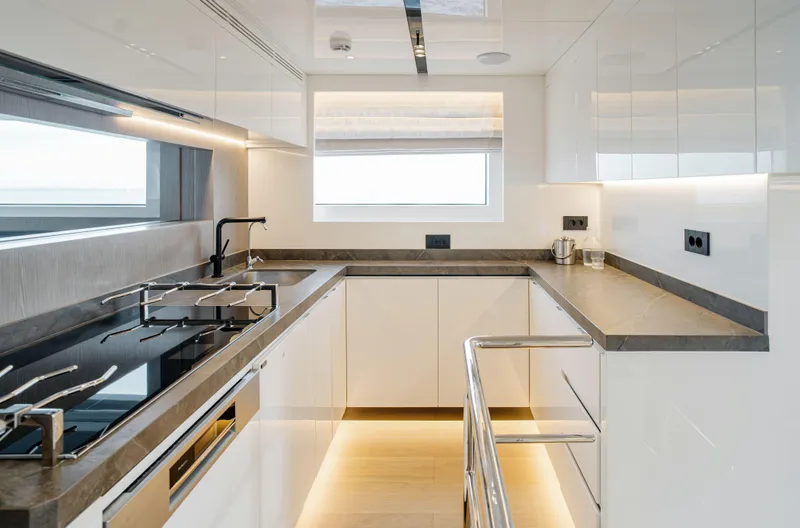 Bering 65 Explorer Yacht Yacht Photos Pics Modern kitchen interior on 2026 Bering 65 yacht, featuring sleek design and high-end appliances.
