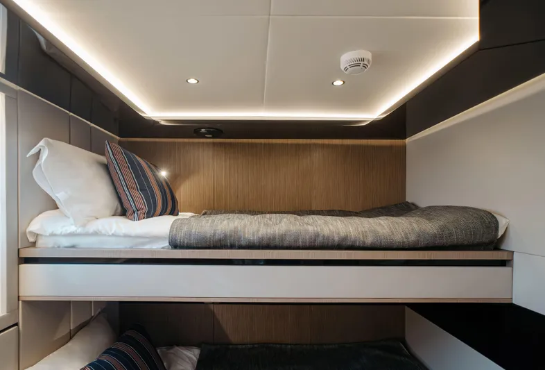 Bering 65 Explorer Yacht Yacht Photos Pics 2026 Bering 65 yacht interior with modern bunk beds and ambient lighting.