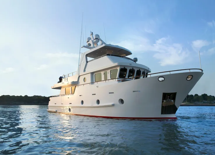 Bering 65 Explorer Yacht Yacht Photos Pics Luxury Bering 65 yacht, 2026 model, cruising on calm waters at sunset.