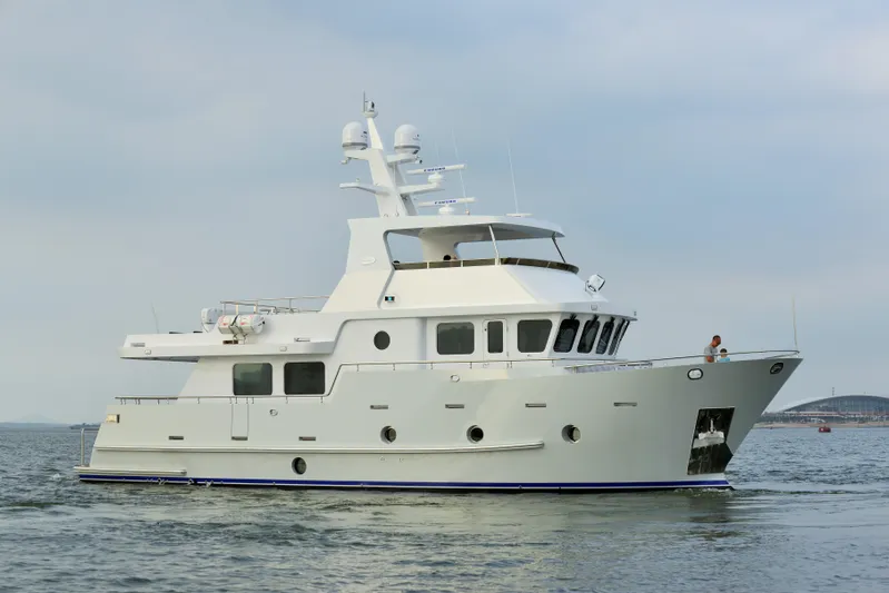 Bering 65 Explorer Yacht Yacht Photos Pics 2026 Bering 65 yacht cruising on calm waters under a clear sky.