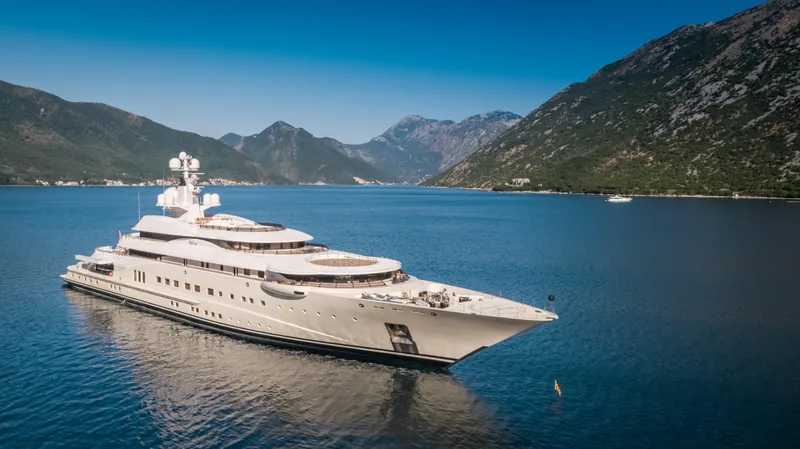 Pelorus Yacht Photos Pics Luxurious 2003 Lurssen Custom yacht cruising in scenic mountainous waters.