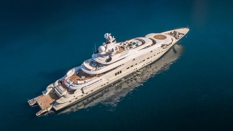 Pelorus Yacht Photos Pics Luxurious 2003 Lurssen Custom yacht cruising on clear blue waters.