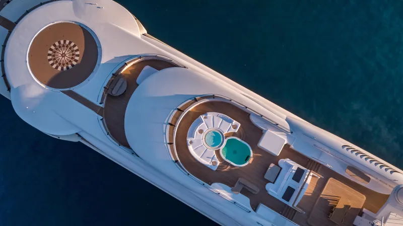 Pelorus Yacht Photos Pics Aerial view of 2003 Lurssen Custom yacht with helipad and pool on deck.