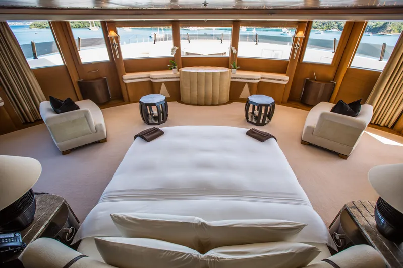 Pelorus Yacht Photos Pics Luxurious yacht interior with panoramic windows, plush seating, and elegant decor, Lurssen Custom 2003.