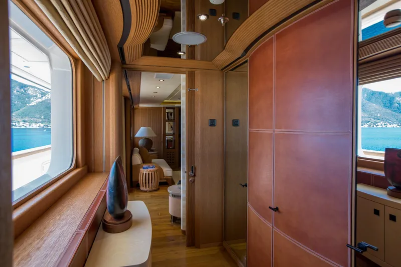 Pelorus Yacht Photos Pics Luxurious interior of 2003 Lurssen Custom yacht with wood and leather finishes, ocean view.