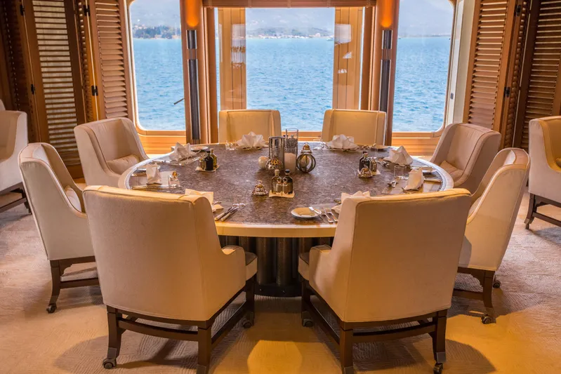 Pelorus Yacht Photos Pics Luxurious dining area on 2003 Lurssen Custom yacht with ocean view.