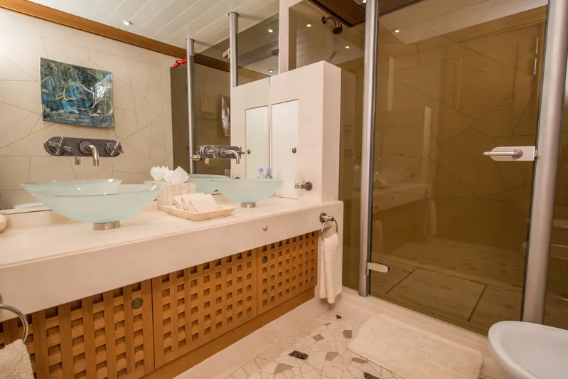 Pelorus Yacht Photos Pics Luxurious yacht bathroom with glass sinks, modern fixtures, and elegant decor, Lurssen Custom 2003.