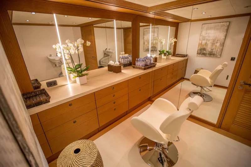 Pelorus Yacht Photos Pics Luxurious yacht interior with elegant vanity, mirrors, and plush seating, Lurssen Custom 2003 model.