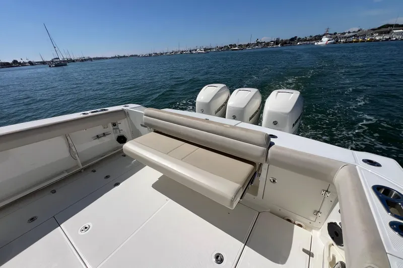 M22 Yacht Photos Pics 2019 Boston Whaler 380 Outrage boat with triple Mercury engines on open water.