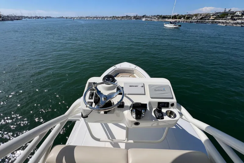 M22 Yacht Photos Pics 2019 Boston Whaler 380 Outrage helm with Garmin navigation, overlooking calm waters.
