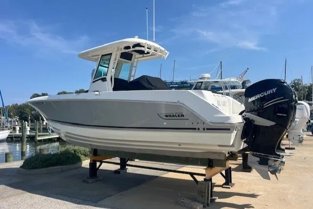  Yacht Photos Pics 2020 Boston Whaler 280 Outrage boat on display with Mercury engines, dockside setting.