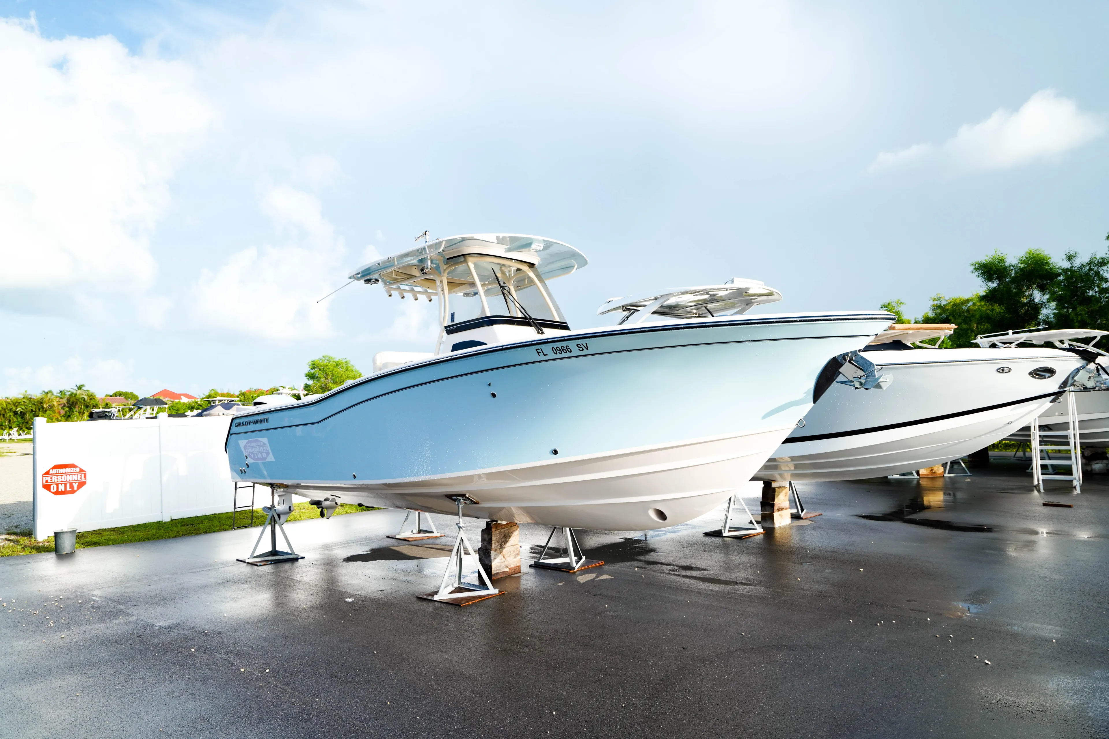  Yacht Photos Pics 2021 Grady-White Canyon 271 boat displayed outdoors on stands.