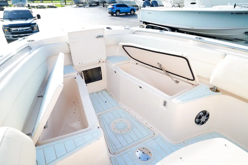  Yacht Photos Pics 2021 Grady-White Canyon 271 boat interior with storage compartments and seating.