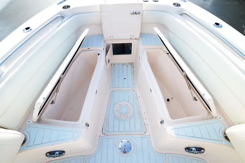  Yacht Photos Pics 2021 Grady-White Canyon 271 boat interior with spacious seating and storage compartments.