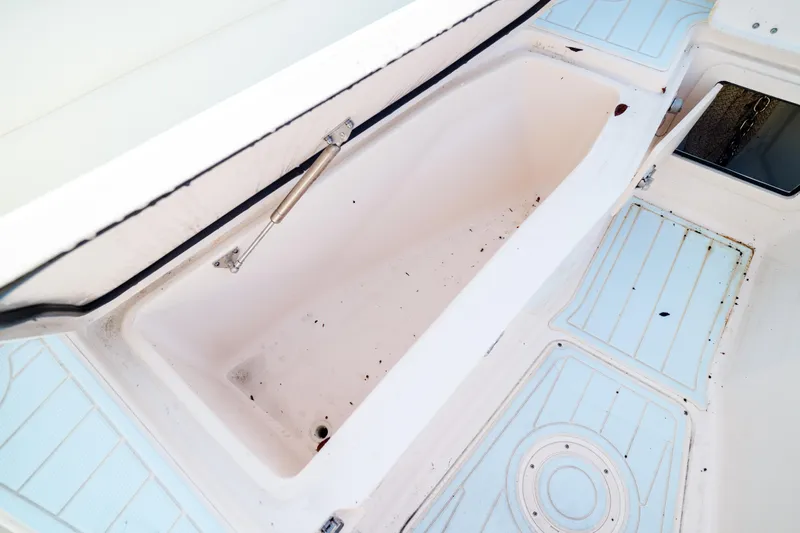  Yacht Photos Pics Grady-White Canyon 271 boat storage compartment, 2021 model, with light blue deck accents.
