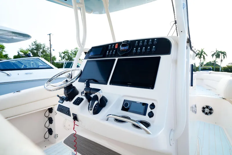  Yacht Photos Pics 2021 Grady-White Canyon 271 boat dashboard with modern controls and displays.