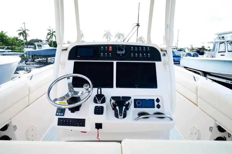  Yacht Photos Pics 2021 Grady-White Canyon 271 boat dashboard with modern controls and steering wheel.