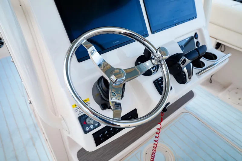  Yacht Photos Pics Steering wheel and controls of 2021 Grady-White Canyon 271 boat.