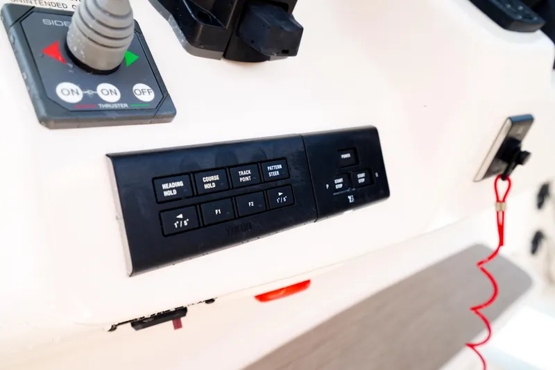  Yacht Photos Pics Control panel of 2021 Grady-White Canyon 271 boat with various switches and buttons.