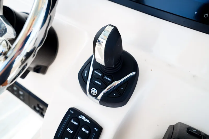  Yacht Photos Pics 2021 Grady-White Canyon 271 boat control panel with joystick and buttons.