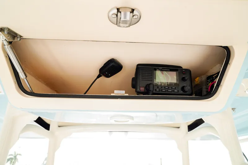  Yacht Photos Pics 2021 Grady-White Canyon 271 boat radio compartment with communication equipment.