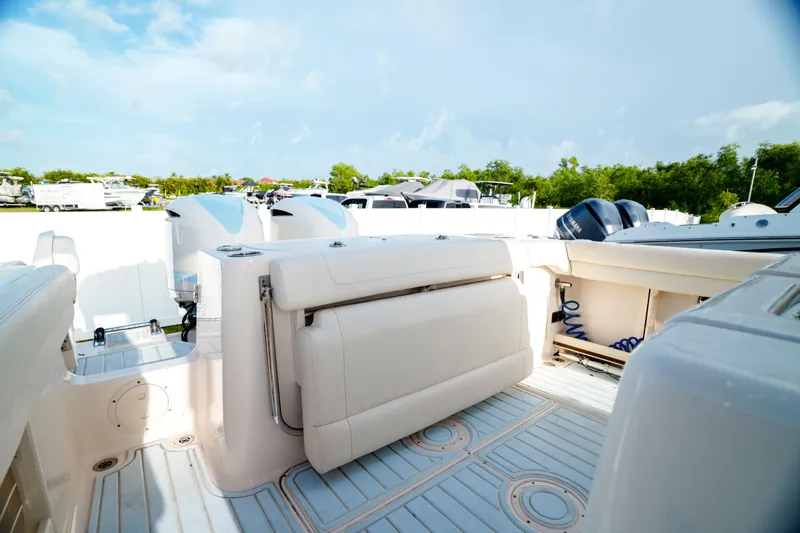  Yacht Photos Pics 2021 Grady-White Canyon 271 boat interior with seating and storage compartments.