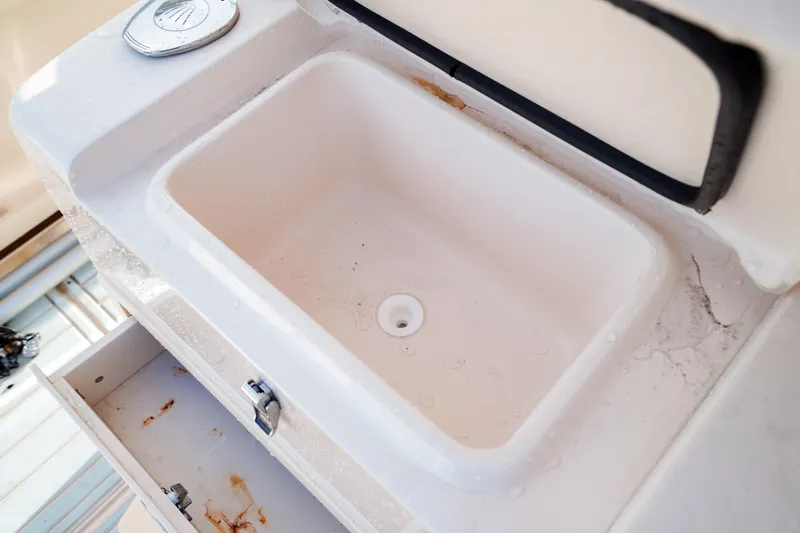  Yacht Photos Pics Grady-White Canyon 271 boat sink and storage, 2021 model.