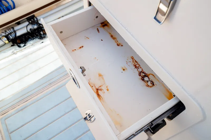  Yacht Photos Pics Open drawer with rust stains on a 2021 Grady-White Canyon 271 boat.