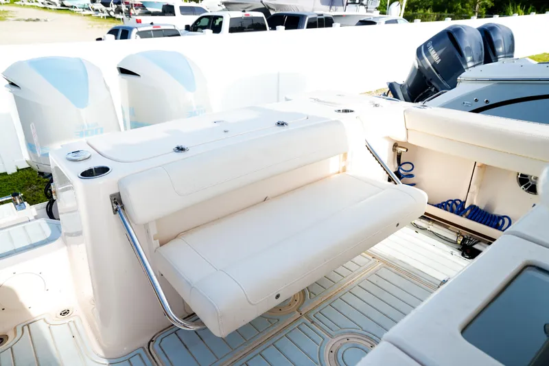  Yacht Photos Pics 2021 Grady-White Canyon 271 boat interior with foldable seating and twin engines.