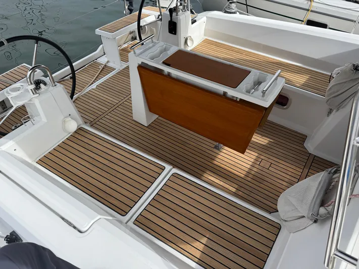 Gayle Force Yacht Photos Pics Cockpit of 2014 Beneteau Oceanis 38 sailboat with teak flooring and dual steering wheels.