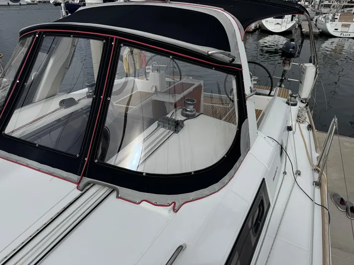 Gayle Force Yacht Photos Pics 2014 Beneteau Oceanis 38 sailboat with cockpit view, docked at marina.
