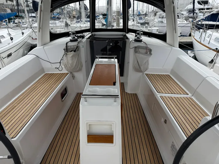 Gayle Force Yacht Photos Pics Cockpit of 2014 Beneteau Oceanis 38 sailboat with teak flooring and seating.