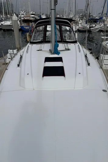 Gayle Force Yacht Photos Pics 2014 Beneteau Oceanis 38 sailboat docked in marina, showcasing sleek deck design.