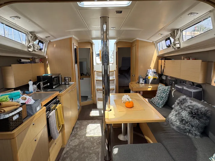 Gayle Force Yacht Photos Pics Interior of 2014 Beneteau Oceanis 38 sailboat, featuring modern kitchen and cozy seating area.